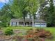 Charming single-story home with a well-maintained lawn and a two-car garage at 162 Apple Valley Dr, Woodstock, GA 30188