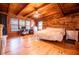 Spacious bedroom featuring wood floors, natural light, a ceiling fan, and lots of space at 6980 Lamplighter Ln, Winston, GA 30187