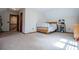 Bedroom featuring soft carpet, neutral walls, and a nearby door leading to another room at 6980 Lamplighter Ln, Winston, GA 30187