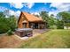 Cozy home with a covered patio, hot tub, and meticulously landscaped front yard at 6980 Lamplighter Ln, Winston, GA 30187