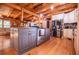 Charming kitchen with stainless steel appliances, wooden countertops, and beautiful wooden floors at 6980 Lamplighter Ln, Winston, GA 30187