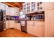 Farmhouse style kitchen featuring stainless steel appliances and wooden floors and countertops at 6980 Lamplighter Ln, Winston, GA 30187