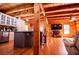 Open concept living room with wooden floors, wooden ceiling and trim, and lots of natural light at 6980 Lamplighter Ln, Winston, GA 30187