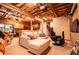 A partially finished basement features exposed ceiling beams and a comfortable entertainment space at 6980 Lamplighter Ln, Winston, GA 30187