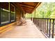 Inviting porch featuring rocking chairs, wood floors, and a tranquil outdoor space at 6980 Lamplighter Ln, Winston, GA 30187
