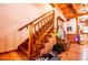 Wooden staircase leading to the second floor, complete with charming wood accents and a cozy landing area at 6980 Lamplighter Ln, Winston, GA 30187
