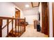 Second view of a upstairs landing area featuring neutral carpet, and a view into the hall at 6980 Lamplighter Ln, Winston, GA 30187