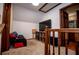 Cozy upstairs landing area, perfect for relaxation and entertainment, with a view into bathroom at 6980 Lamplighter Ln, Winston, GA 30187