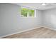 Finished basement area featuring wood-look flooring and natural light from a large window at 193 Cedar Creek Dr, Dallas, GA 30157