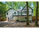 Back exterior of the home with a deck and staircase at 193 Cedar Creek Dr, Dallas, GA 30157