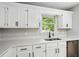 Close up on kitchen featuring white cabinets, stainless steel appliances and countertops at 193 Cedar Creek Dr, Dallas, GA 30157