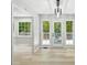 Bright living room features light wood floors, and large windows for an airy and welcoming atmosphere at 193 Cedar Creek Dr, Dallas, GA 30157