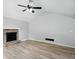 Cozy living room with vaulted ceiling, stone fireplace, and modern flooring, creating a warm and inviting atmosphere at 193 Cedar Creek Dr, Dallas, GA 30157