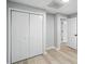 Finished room with neutral paint, wood-look floors, and white closet doors at 193 Cedar Creek Dr, Dallas, GA 30157