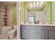 Bathroom with double vanity, tile floor, and a shower-tub combo with tiled walls at 317 Basel Way, Hampton, GA 30228