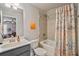 Bright bathroom featuring a shower-tub combo with nautical-themed shower curtain at 317 Basel Way, Hampton, GA 30228