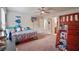 Bedroom with carpet floors, a bunk bed, a TV, and an ensuite bathroom at 317 Basel Way, Hampton, GA 30228