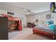 Bedroom featuring carpet floors, a ceiling fan, and a built in bunk bed with ladder at 317 Basel Way, Hampton, GA 30228