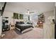 Cozy bedroom features a queen-sized bed, ceiling fan, and a bookshelf at 317 Basel Way, Hampton, GA 30228
