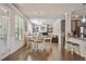 Bright dining area filled with natural light, complemented by views of the backyard and modern light fixtures at 317 Basel Way, Hampton, GA 30228
