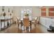 Elegant dining room with hardwood floors and wainscoting at 317 Basel Way, Hampton, GA 30228