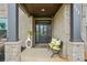 Inviting front porch with stylish seating and elegant decor at 317 at 317 Basel Way, Hampton, GA 30228