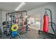 Workout equipment inside a spacious 2-car garage with weight training and boxing at 317 Basel Way, Hampton, GA 30228