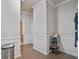 Hallway featuring paneled walls and plenty of storage at 317 Basel Way, Hampton, GA 30228