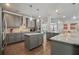 Modern kitchen boasts granite countertops, stainless steel appliances, and ample cabinet space at 317 Basel Way, Hampton, GA 30228