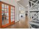 Bright living area showcasing hardwood floors and glass doors at 317 Basel Way, Hampton, GA 30228