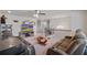 Open loft space with plush seating, a ceiling fan, recessed lights, and plenty of windows at 317 Basel Way, Hampton, GA 30228