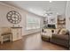 Functional home office with custom built-ins, a ceiling fan, and plenty of natural light at 317 Basel Way, Hampton, GA 30228
