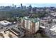 Aerial view of condo building with city skyline, street views and surrounding landscape at 3820 Roswell Ne Rd # 705, Atlanta, GA 30342