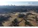Stunning aerial view of a lush golf course with city skyline in the background at 3820 Roswell Ne Rd # 705, Atlanta, GA 30342