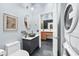 Bathroom with modern sink, laundry area, and adjoining washroom at 3820 Roswell Ne Rd # 705, Atlanta, GA 30342
