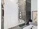 Modern bathroom with a glass-enclosed shower featuring sleek tile and rainfall shower head at 3820 Roswell Ne Rd # 705, Atlanta, GA 30342