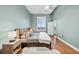 Tranquil bedroom featuring soft blue walls, hardwood floors, and cozy natural light at 3820 Roswell Ne Rd # 705, Atlanta, GA 30342