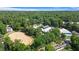 An aerial view of an equestrian center featuring stables, training areas, and lush landscaping for a premier horse riding experience at 3820 Roswell Ne Rd # 705, Atlanta, GA 30342