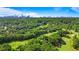 Scenic aerial view of a golf course with lush greenery and cityscape in the background, perfect for recreation and relaxation at 3820 Roswell Ne Rd # 705, Atlanta, GA 30342