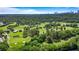 Lush golf course with mature trees, manicured greens, and a scenic view of the city skyline in the distance at 3820 Roswell Ne Rd # 705, Atlanta, GA 30342