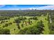 Picturesque golf course view featuring mature trees and rolling green hills against a beautiful skyline backdrop at 3820 Roswell Ne Rd # 705, Atlanta, GA 30342