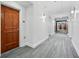 Well-lit hallway featuring neutral walls, modern lighting and attractive flooring at 3820 Roswell Ne Rd # 705, Atlanta, GA 30342