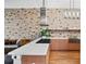 Stylish kitchen with modern appliances, granite counters, and exposed brick details at 3820 Roswell Ne Rd # 705, Atlanta, GA 30342