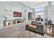 Bright living room with large windows, modern decor, and comfortable seating arrangement at 3820 Roswell Ne Rd # 705, Atlanta, GA 30342
