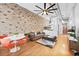 Comfortable living area with hardwood floors, exposed brick, and a contemporary design at 3820 Roswell Ne Rd # 705, Atlanta, GA 30342
