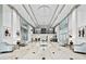 Grand lobby with stylish seating areas, high ceilings, and contemporary lighting at 3820 Roswell Ne Rd # 705, Atlanta, GA 30342
