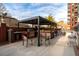 Outdoor kitchen with grill, countertop space, seating, and shade from a pergola at 3820 Roswell Ne Rd # 705, Atlanta, GA 30342
