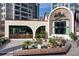 Unique Delilah Restaurant exterior with archways, lush greenery, and charming design in Buckhead Village, Atlanta at 3820 Roswell Ne Rd # 705, Atlanta, GA 30342