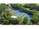 Aerial view of well-maintained tennis courts surrounded by lush greenery, creating a serene recreational space at 3820 Roswell Ne Rd # 705, Atlanta, GA 30342