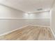 Unfinished basement space with neutral paint and modern flooring at 7160 Royston Way, Cumming, GA 30028